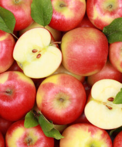 Group of red apples with their leaves